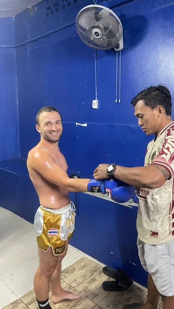 Two fighters with garlands after a win at Samui International Stadium