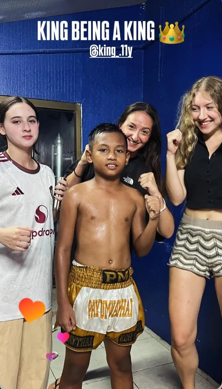 Young fighter King posing with supporters after an April 2026 fight