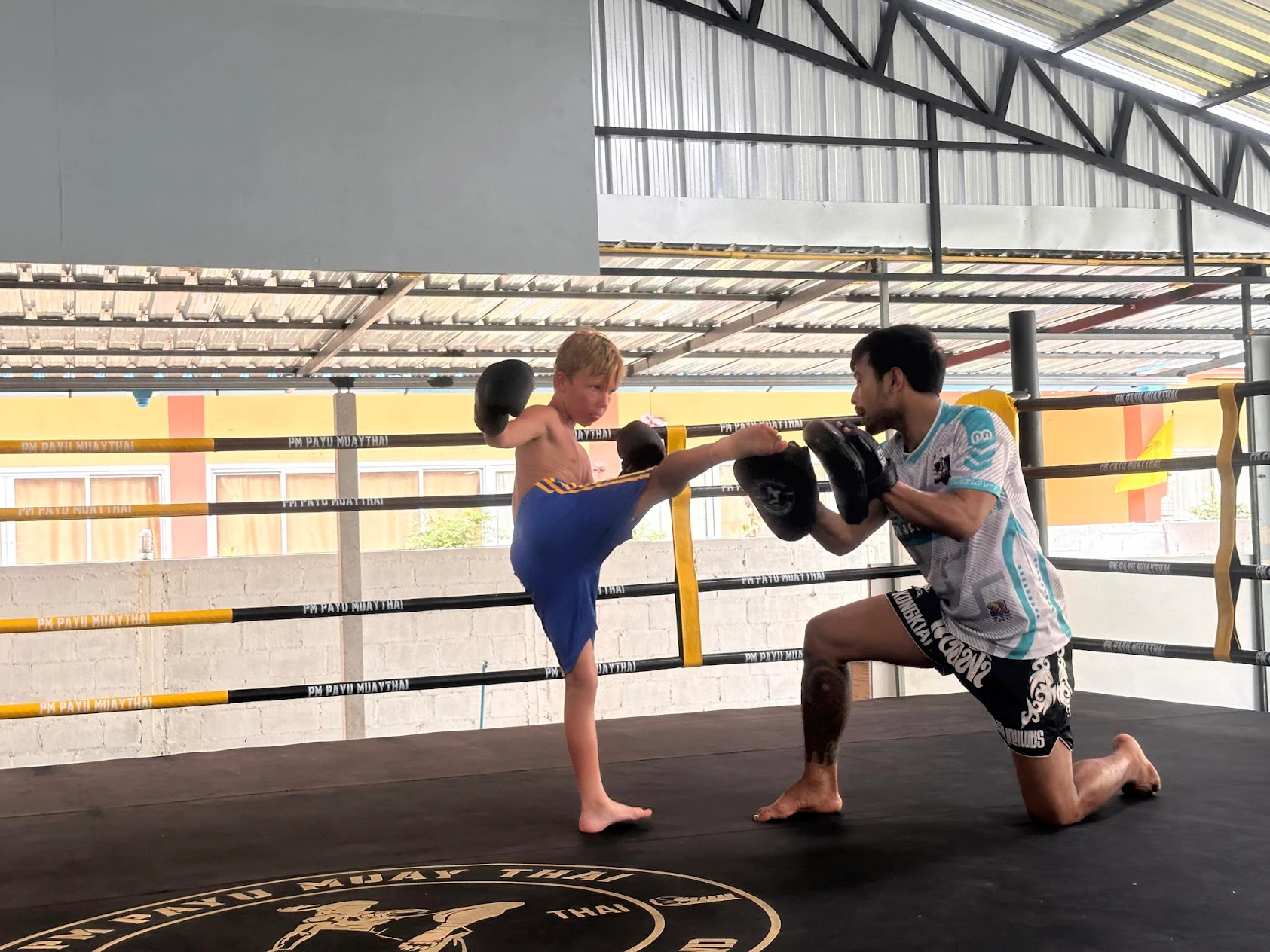 Kru Kong with a young student after kids class at PM PAYU, Koh Samui