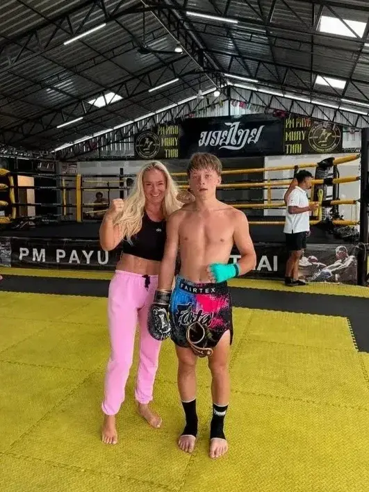 Mother and son posing after training at PM PAYU Muay Thai, Koh Samui