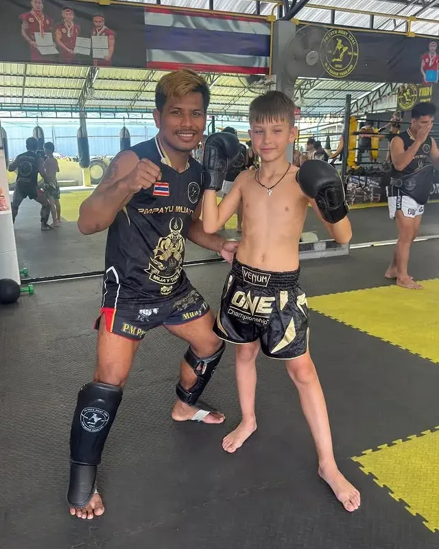 Kru Koban with a young student at PM PAYU Muaythai