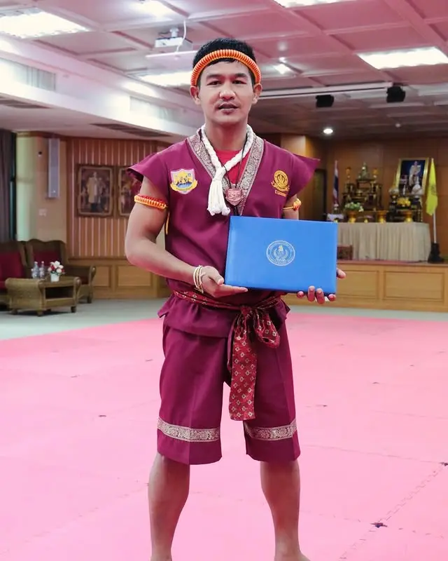 Kru Payu holding a Muay Thai certification, Koh Samui